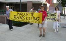 Bob Graf and others holding signs at protest